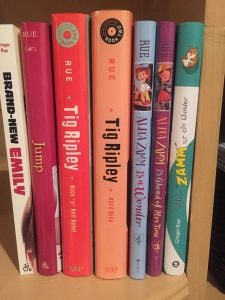 A stack of colorful hardcover books